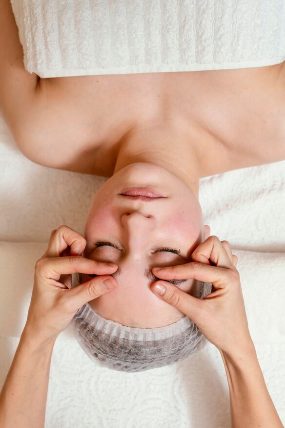 close-up-hands-massaging-face